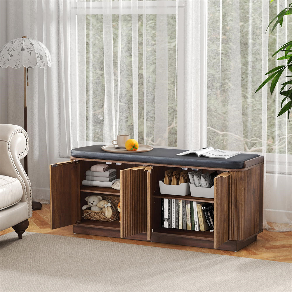 Wooden storage bench with upholstered top in a living room setting