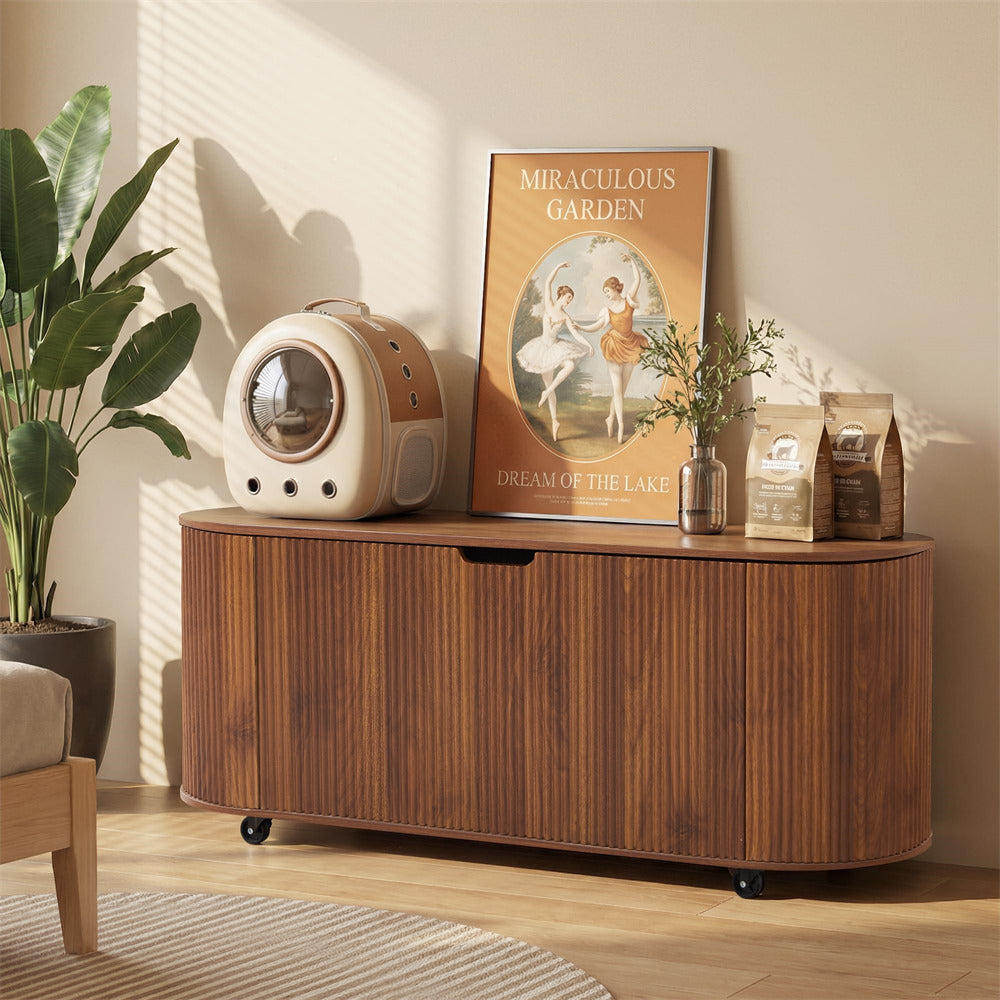 Wooden sideboard with decorative items in a room with a plant and poster.
