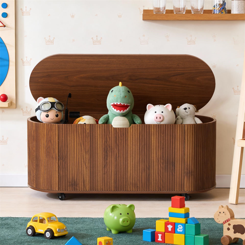 Wooden toy storage box with stuffed animals and toys on a floor.
