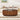 Wooden coffee table in a living room with a sofa and decorative items.