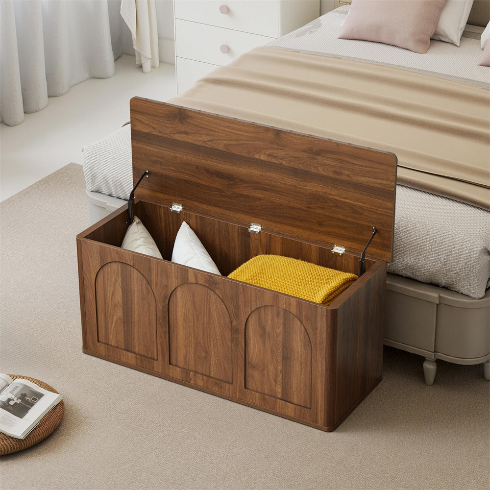 Wooden storage bench with cushions in a bedroom setting