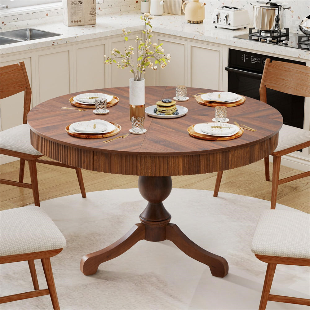 Wooden dining table set in a kitchen with chairs and plates.