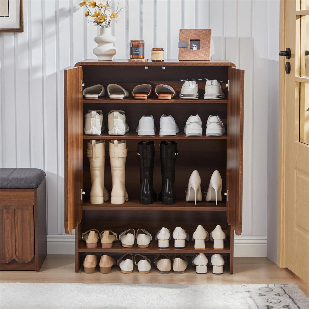 Walnut wooden 5-tier shoe cabinet with various shoes on shelves in a room setting.