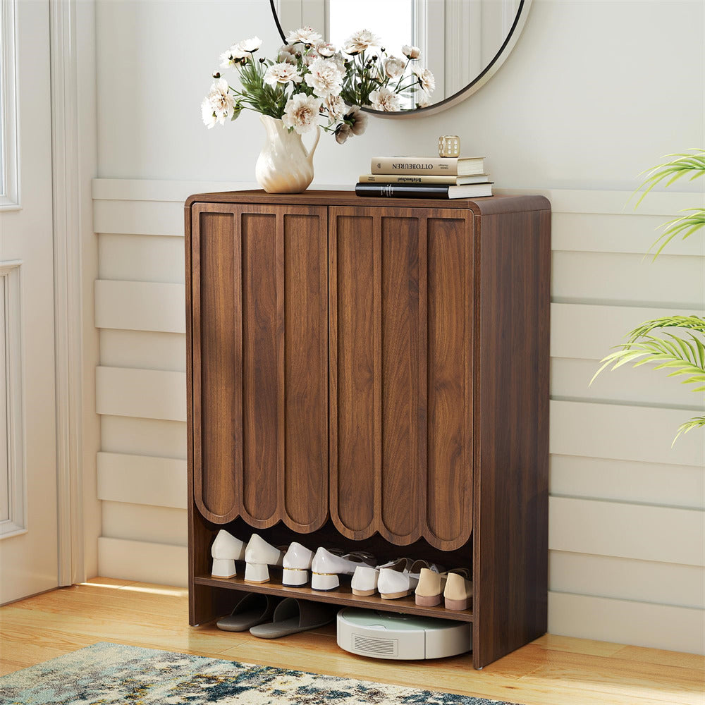 Walnut wooden 5-tier shoe cabinet with shoes on a wooden floor, decorated with flowers and books.