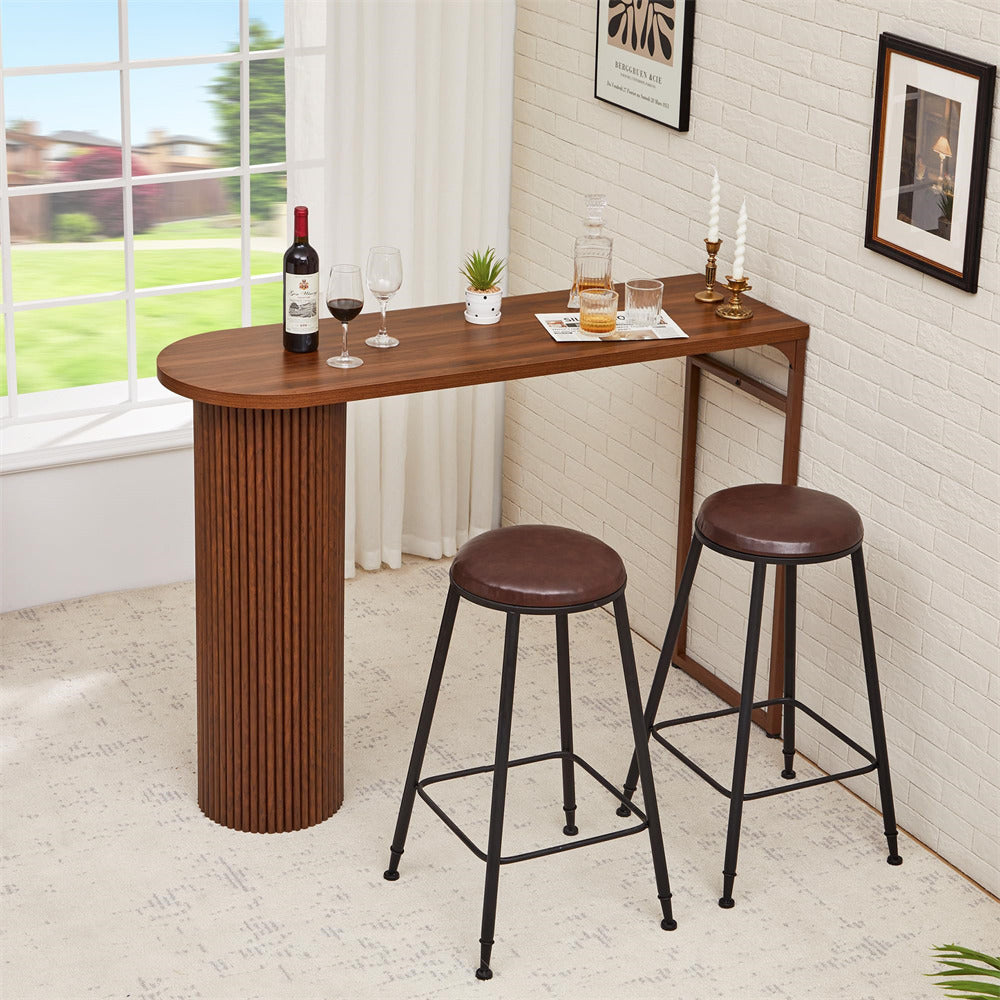Wooden bar table with two stools in a room with a window view.
