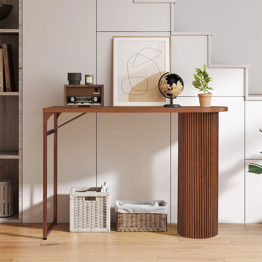 Wooden console table with decorative items in a room setting