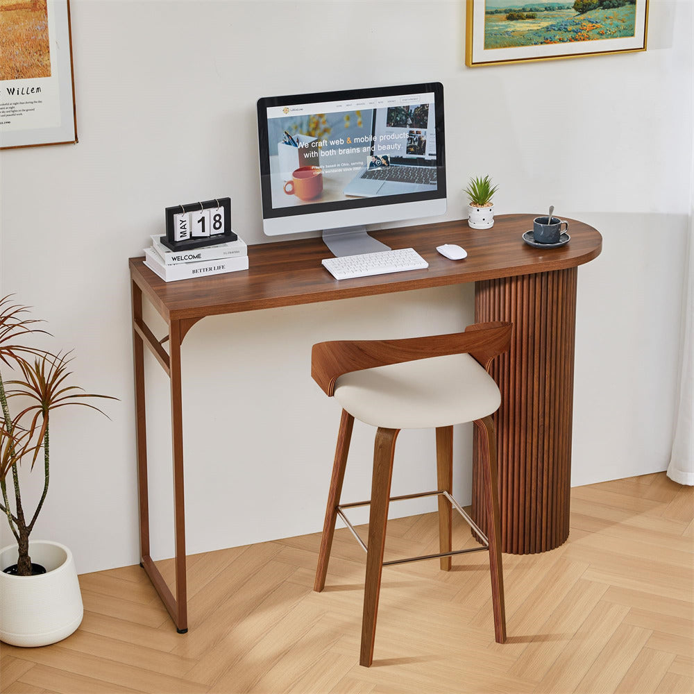Wooden desk with computer setup in a home office setting