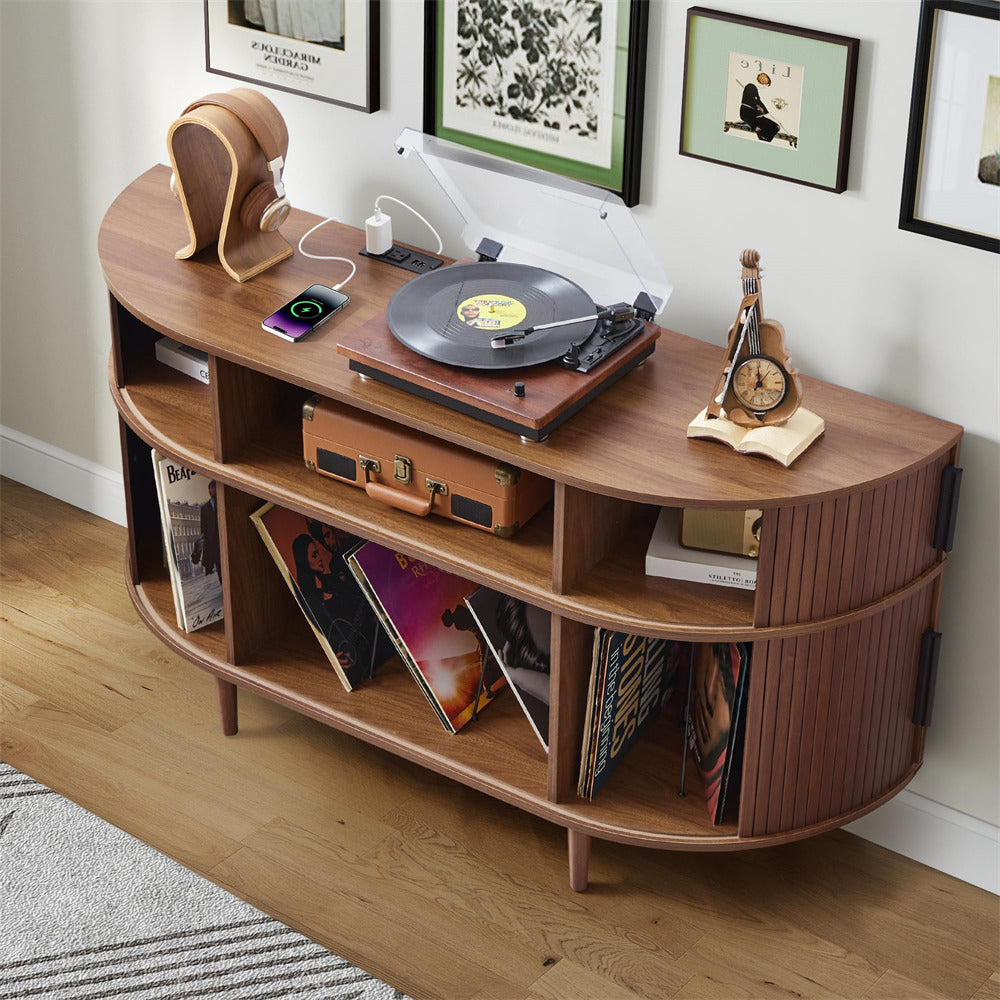Wooden record player console with vinyl records and a turntable on a wooden floor.