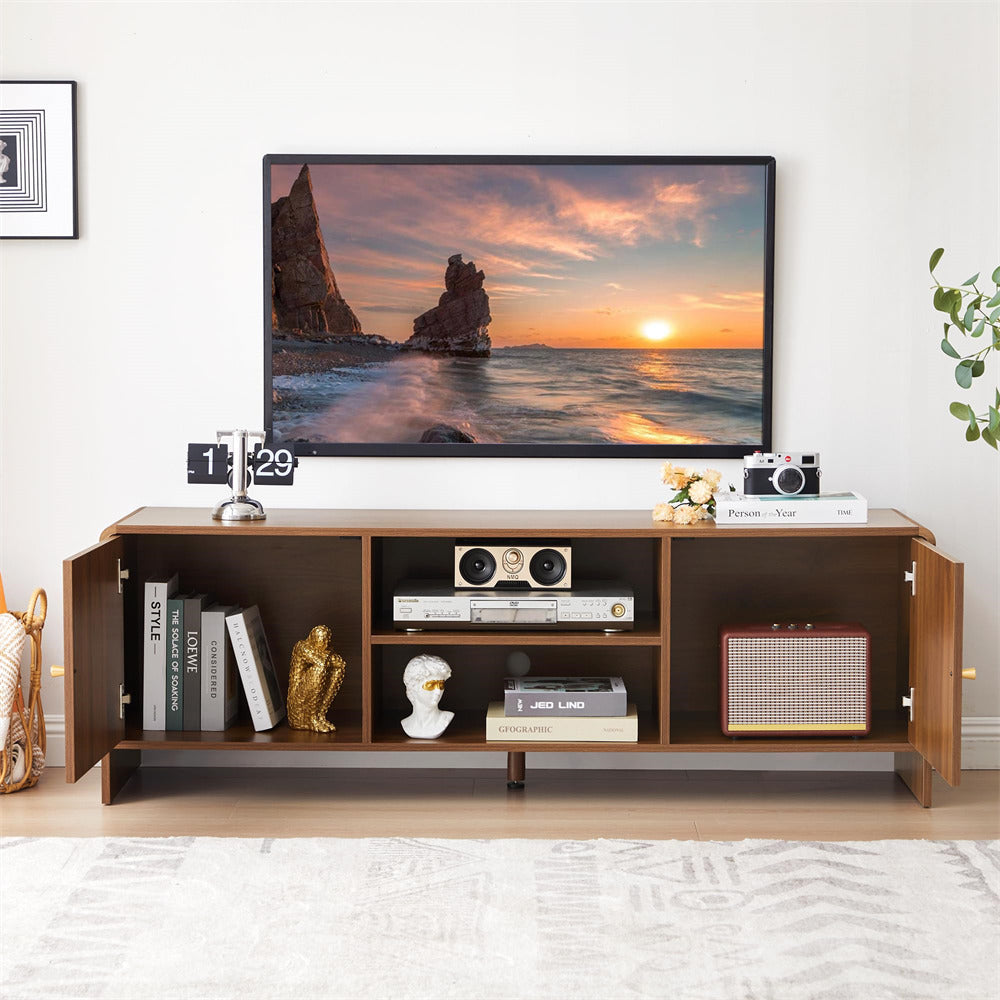 Wooden entertainment console with a television displaying a sunset over water scene, surrounded by decorative items.