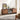Wooden entertainment console in a living room with decor items.