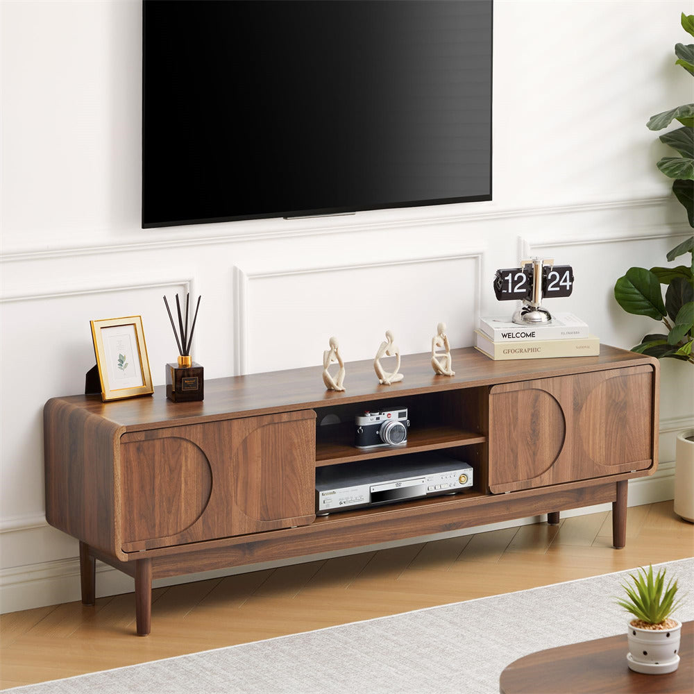 Wooden 59" TV stand with decorative items in a living room setting