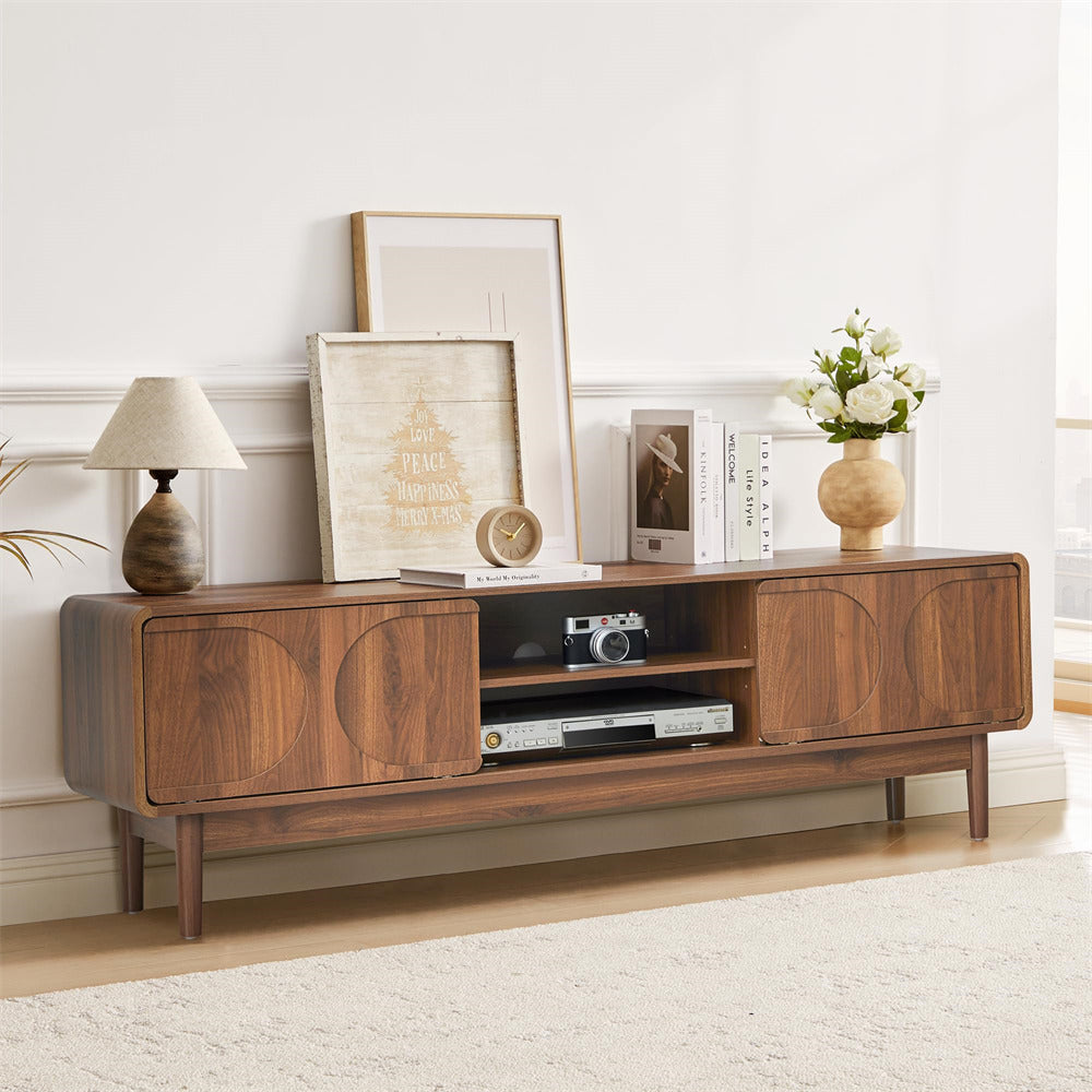 Wooden entertainment console with decorative items in a living room setting