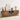 Wooden entertainment console with decorative items in a living room setting