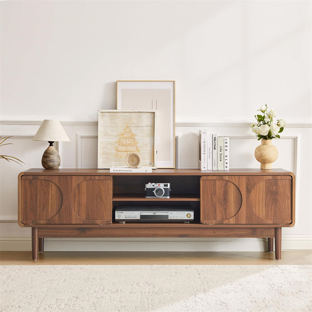 Wooden entertainment console with decorative items in a living room setting