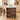 Wooden kitchen island with bar stools in a modern kitchen setting