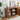 Wooden sideboard with open cabinet displaying decor items in a room.