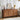 Wooden sideboard in a living room setting with decor items on top