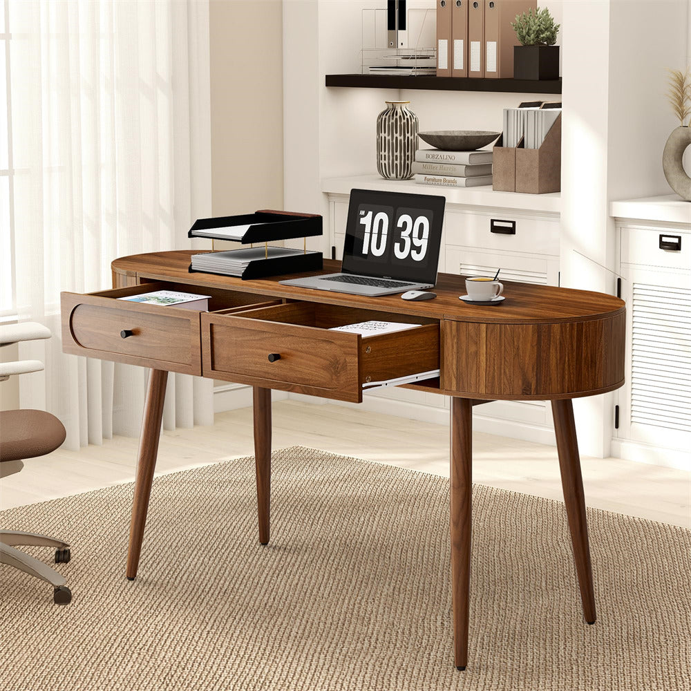 Wooden desk with laptop, lamp, and office supplies in a home office setting.