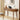 Wooden desk with laptop, lamp, and decor in a home office setting