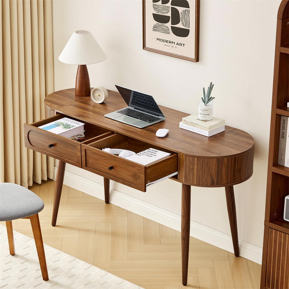Wooden desk with laptop, books, and decor in a home office setting
