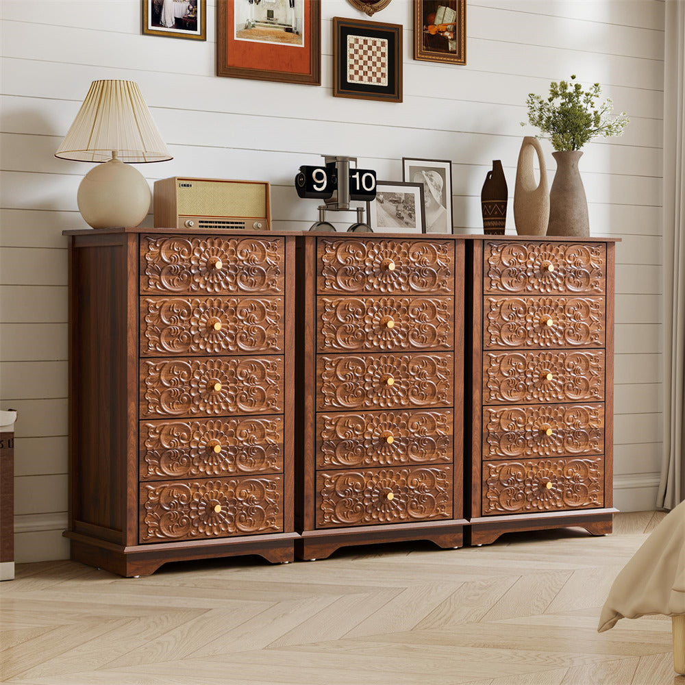 Wooden dresser with intricate carvings in a room setting with decor items.