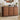 Wooden dresser with intricate carvings in a room setting with decor items.