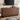 Wooden sideboard in a living room with decor items on top