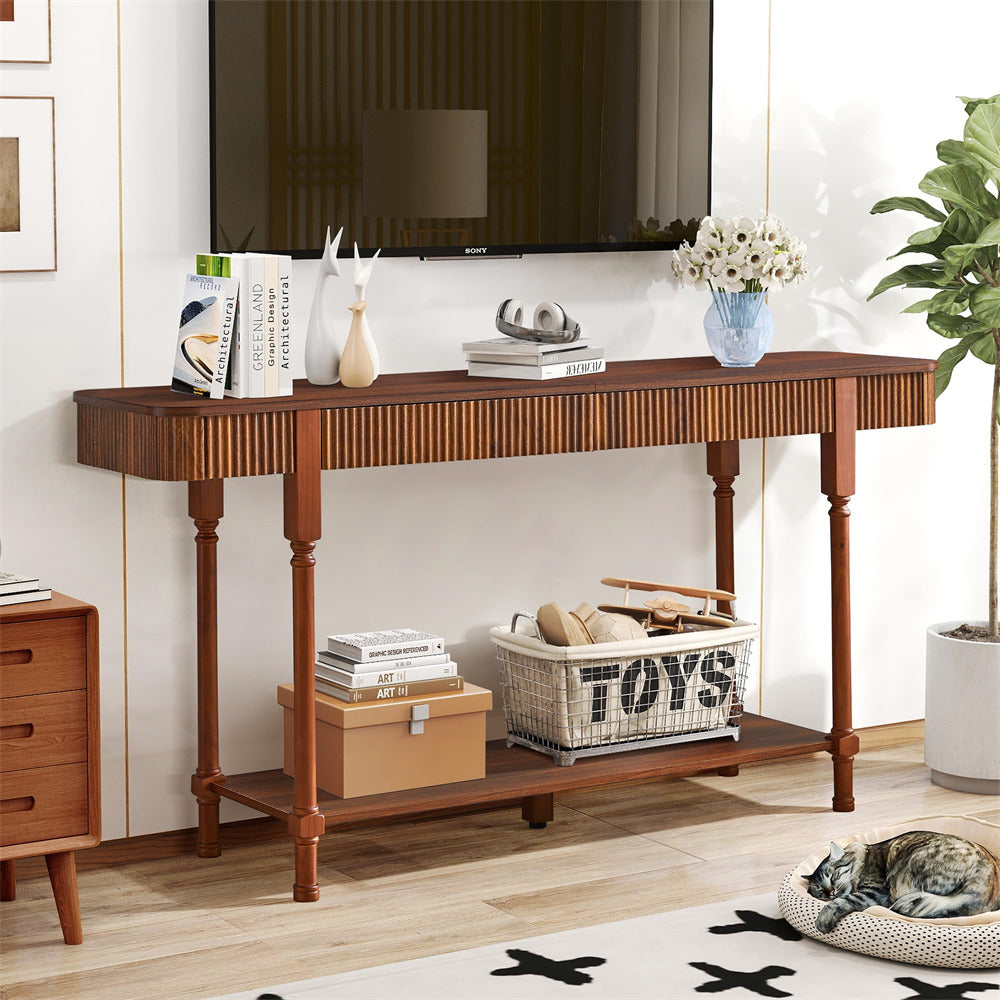Wooden 63" console table in a living room with books, toys, and decorative items.