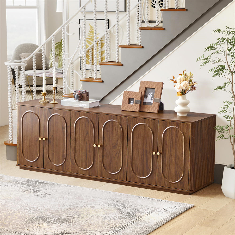 Wooden sideboard with decorative items in a living room setting