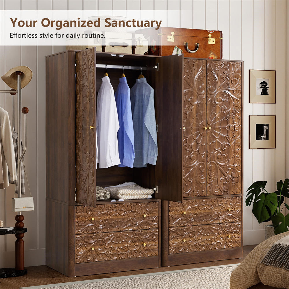 A large carved wooden wardrobe/closet in a styled bedroom setting, with two doors open to show hanging shirts and folded bedding inside. The wardrobe has ornate floral carvings and small gold-tone knobs.