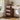 Wooden desk with a modern design in a well-lit room with plants and decor.