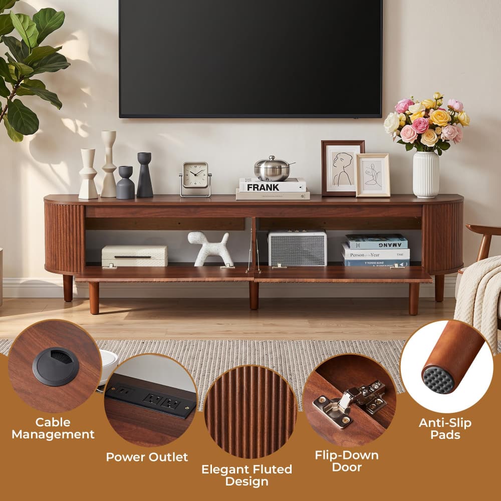 A mid-century modern wooden TV stand in a warm medium brown finish, styled in a living room setting with a wall-mounted TV, decorative objects, and flowers. Four circular inset detail images at the bottom highlight features like cable management, power outlets, elegant fluted design, and anti-slip pads.