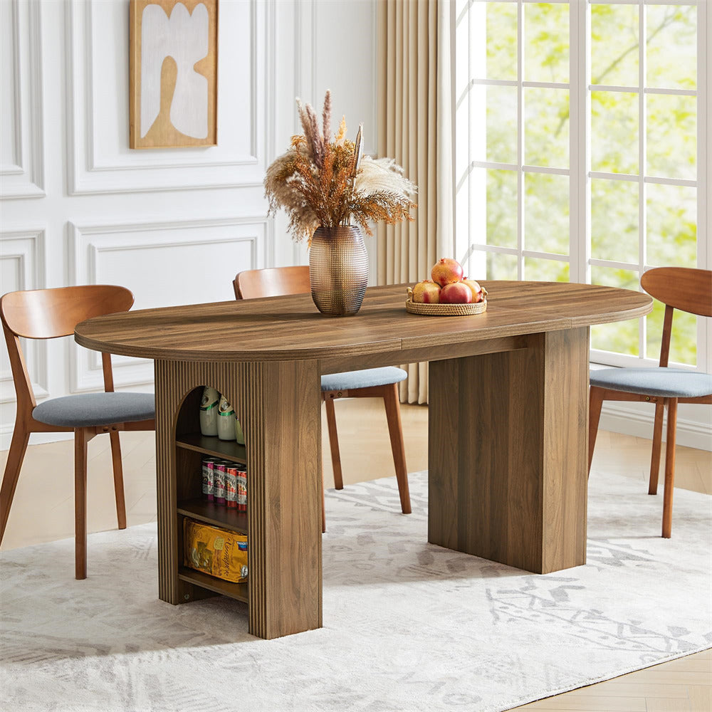Wooden dining table with chairs in a room with large windows.