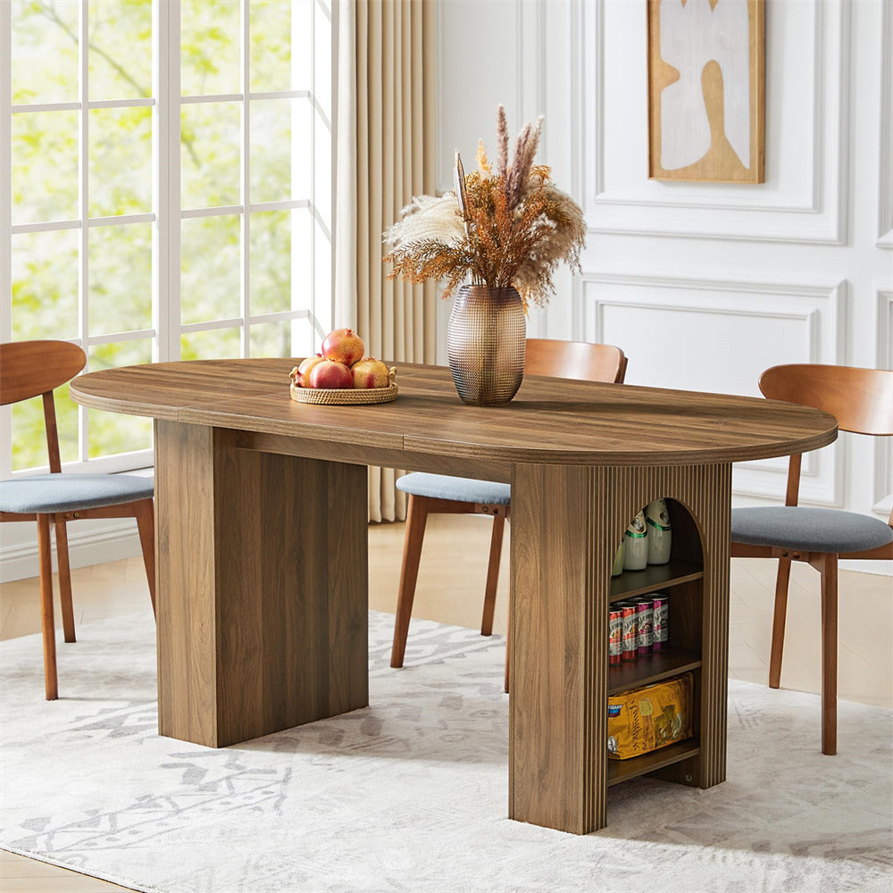Wooden dining table with chairs in a room with large windows.