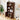 Wooden bookshelf with open door displaying items in a room with decor elements.