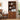Wooden bookshelf with decorative items in a room with a bed and lamp.