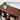 Wooden bookshelf with decorative items and a plant, labeled 'Solid Wood Bookcase'.