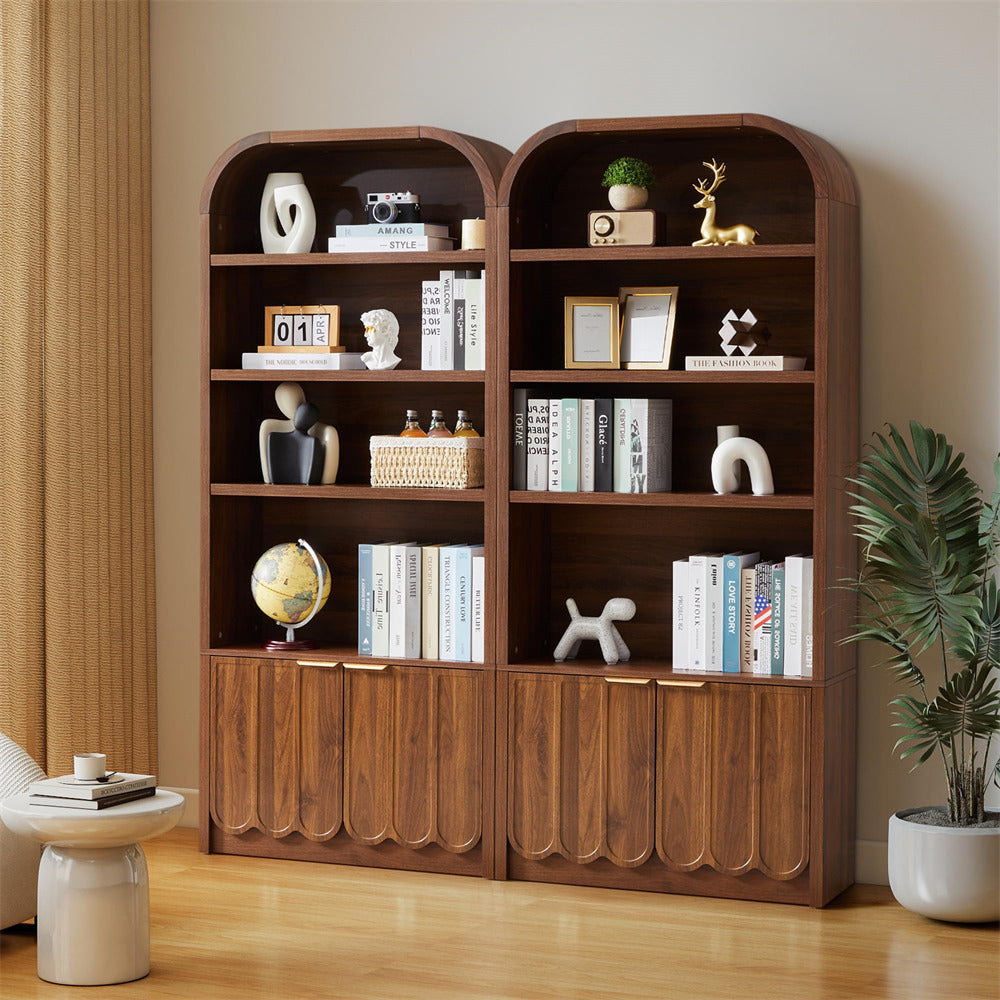 Wooden bookshelf with decorative items in a room with a plant and side table.