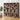 Large wooden bookshelf filled with books and decorative items in a room with a plant and sofa.