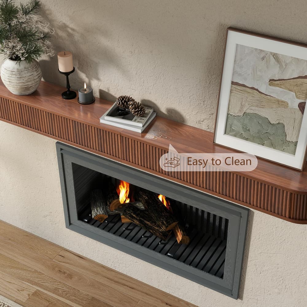 A modern wall-mounted electric fireplace with a dark gray metal frame and faux logs, set into a beige textured wall beneath a wooden mantel decorated with candles, a vase, and framed art. A semi-transparent 'Easy to Clean' badge is overlaid on the right side.