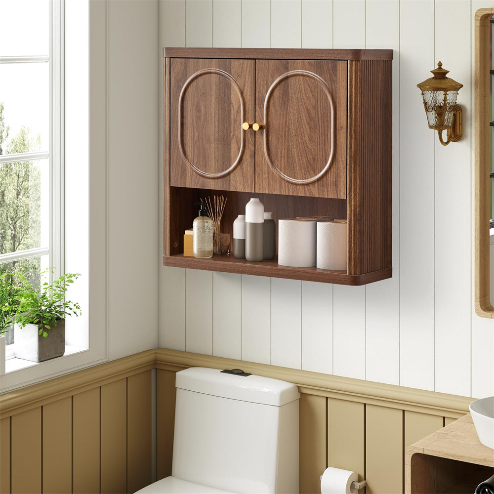 Wooden wall cabinet above a toilet in a bathroom with a window and light fixture.