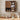 Wooden kitchen cabinet with shelves containing kitchen items on a tiled wall background