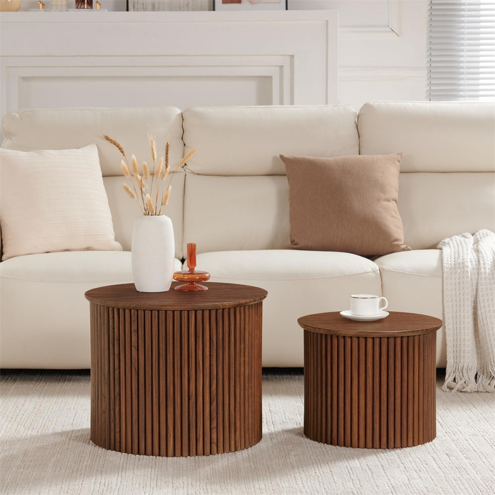 Two wooden side tables with decorative items in a living room setting.