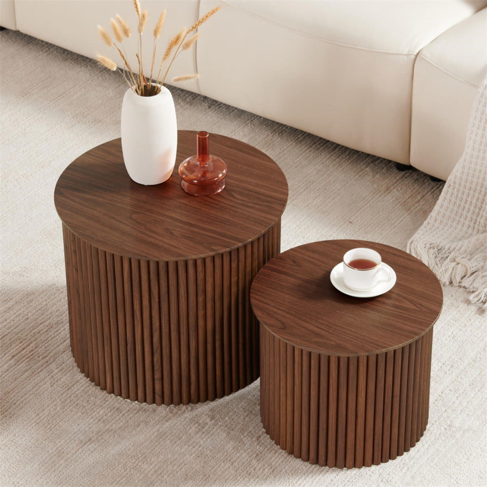 Two wooden side tables with decorative items on a light-colored floor.