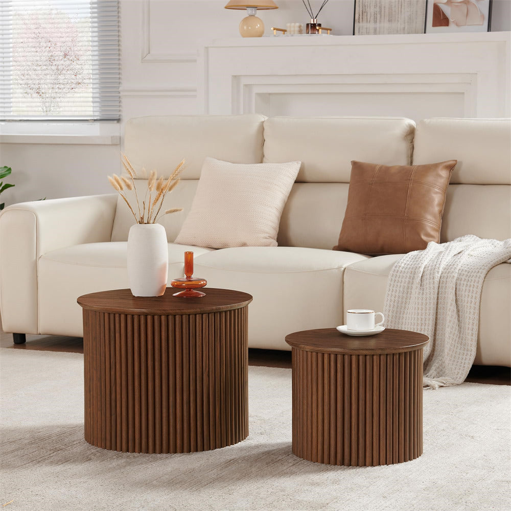 Living room with beige sofa, decorative pillows, and wooden side tables.