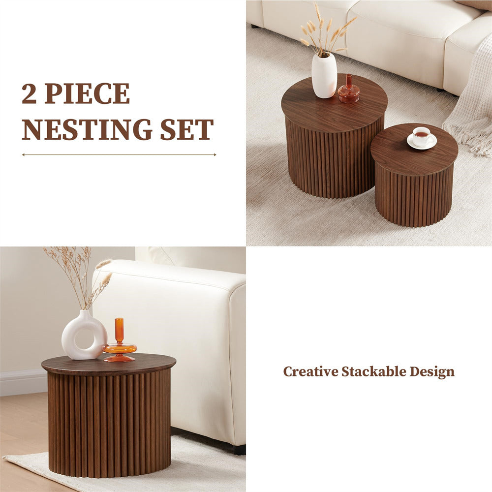 Two wooden nesting tables with decorative items on a living room floor.