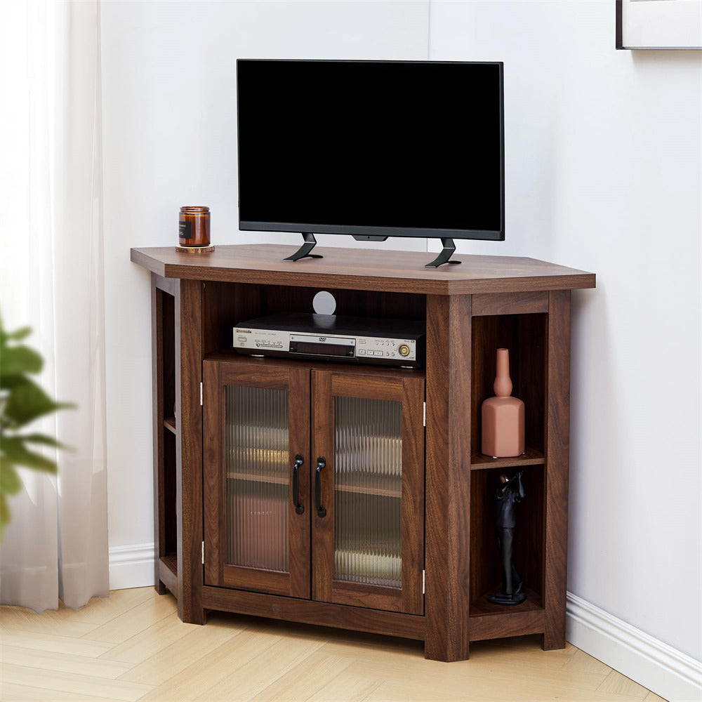 Wooden TV stand with a television and decorative items in a room.