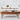 Wooden coffee table with decorative items in a living room setting