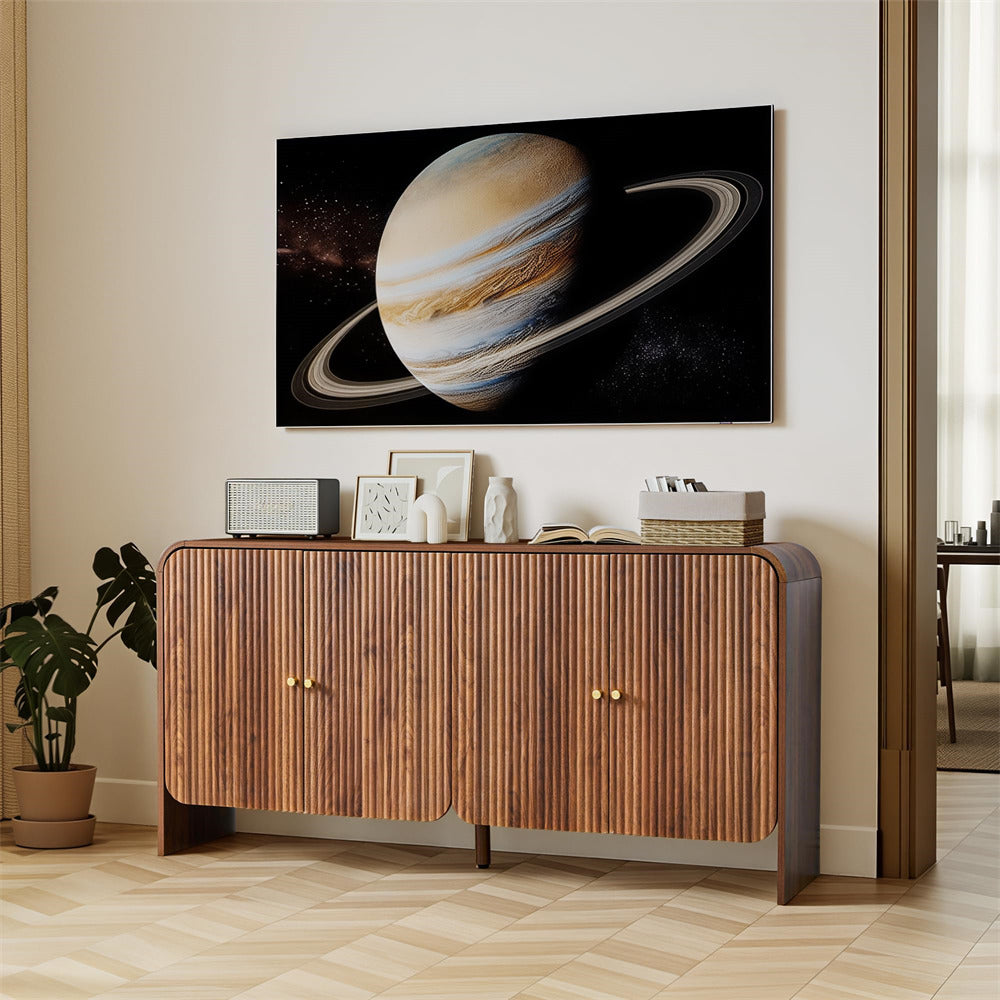 Wooden sideboard with decorative items in a room with a large wall-mounted TV displaying an image of Jupiter.
