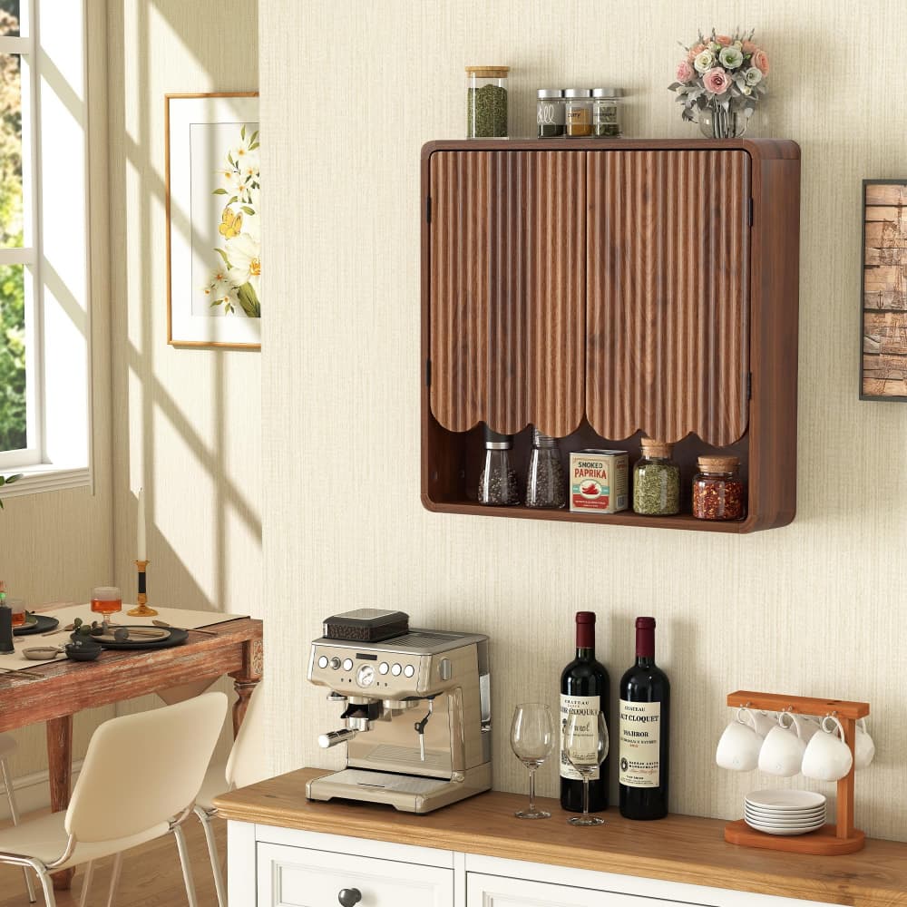 A wall-mounted wooden cabinet with a slatted door and open lower shelf, styled in a kitchen or dining area above a counter with bottles, glasses, and jars.